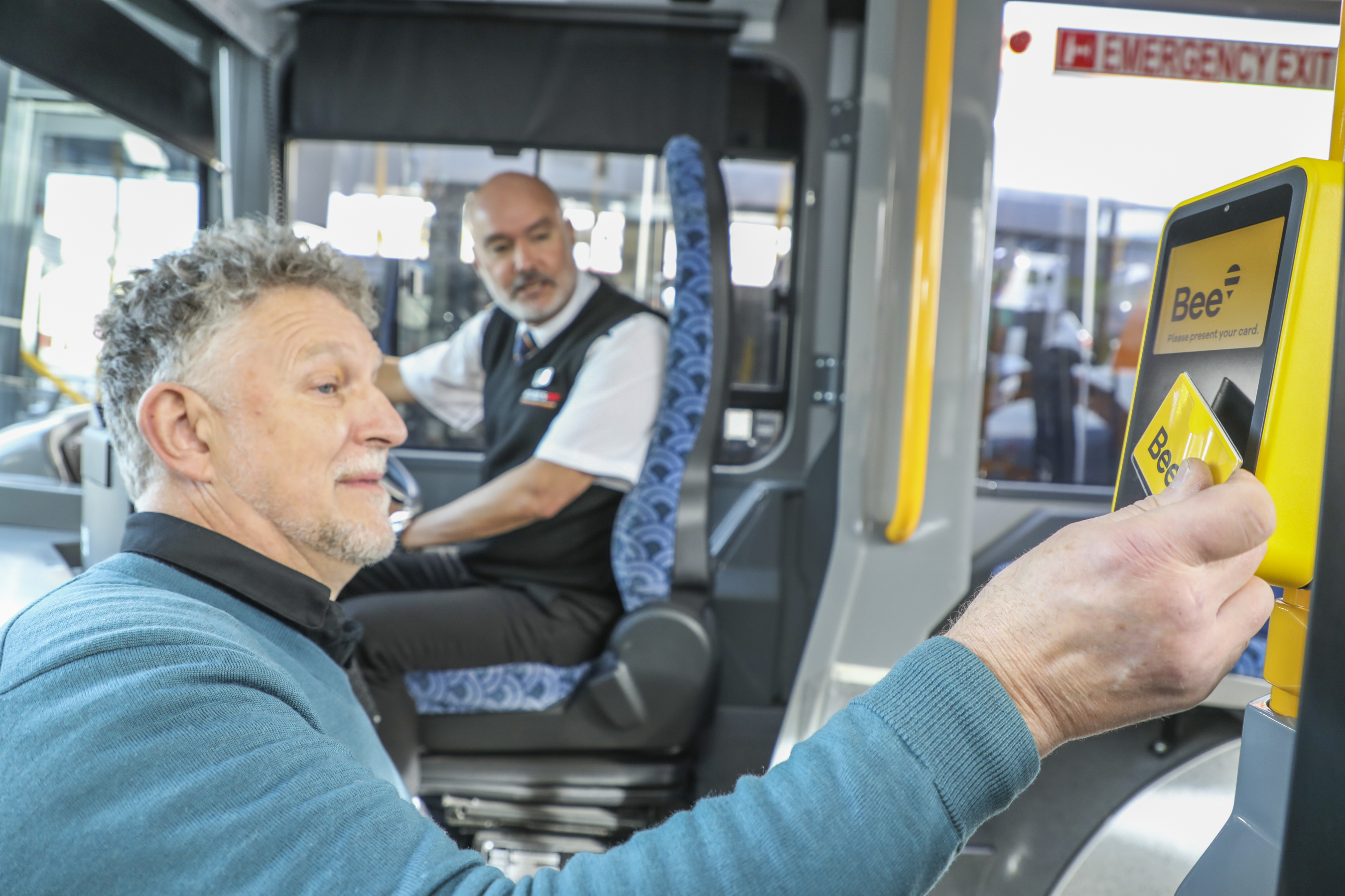 Orbus passenger John Marrable tagging on to the bus using his Bee Card.