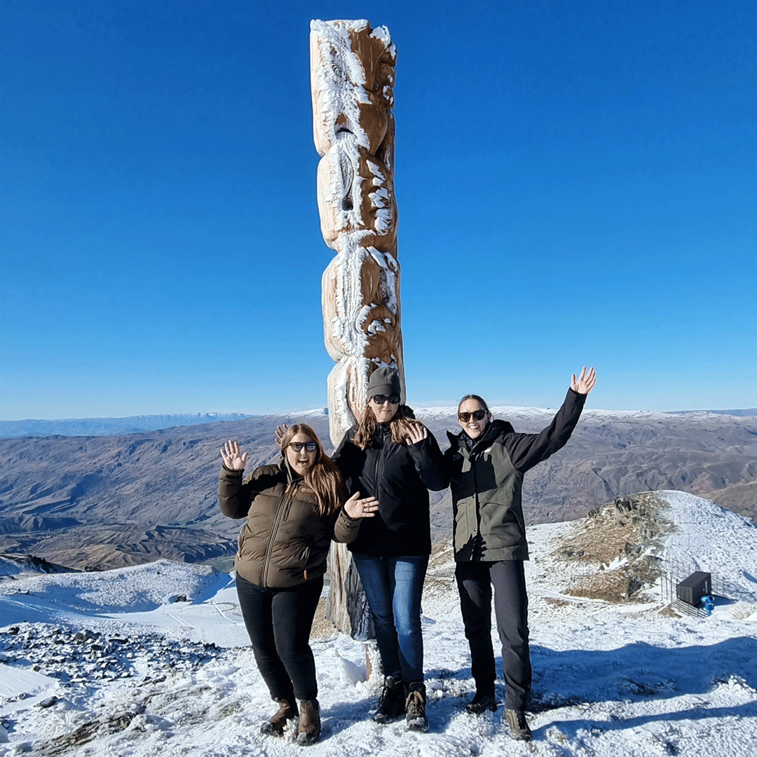 Pictured: Samantha Marsh, QLDC and Nicole Sutton, DOC and Brooke Clark, Catchment Advisor in front of the 'we are all in this together' pou whenua (land post), one of 5 posts for Cardrona that embody their values and goals.