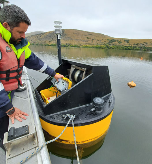 ORC’s Scientist-Lakes, Hugo Borges, on Lake Hayes with a Limnotrack buoy.