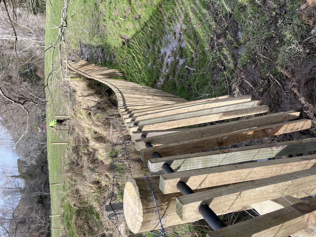 A floating fence allows water and debris to pass during a flood.