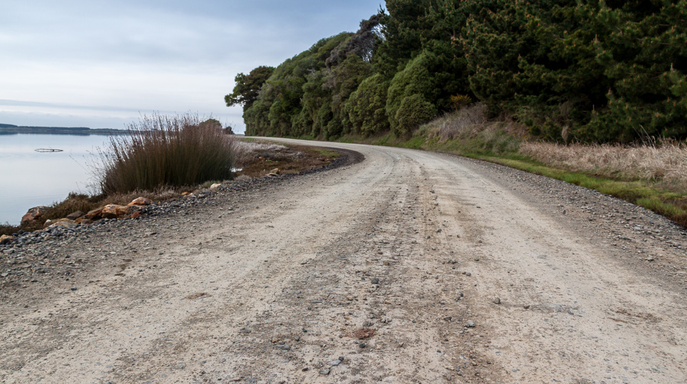 Dirt Gravel Road Curving To The Left Adobestock 225130656