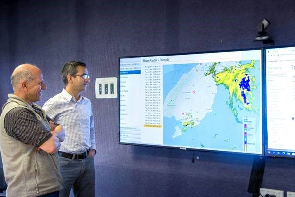 Image: Senior Hydrologist Magdy Mohssen (left) and Manager Natural Hazards Jean-Luc Payan checking out rain radar information for Dunedin (available in high resolution).