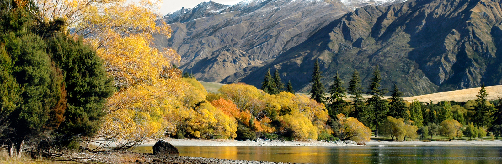 Lake Wānaka in Autumn, view across water to mountains