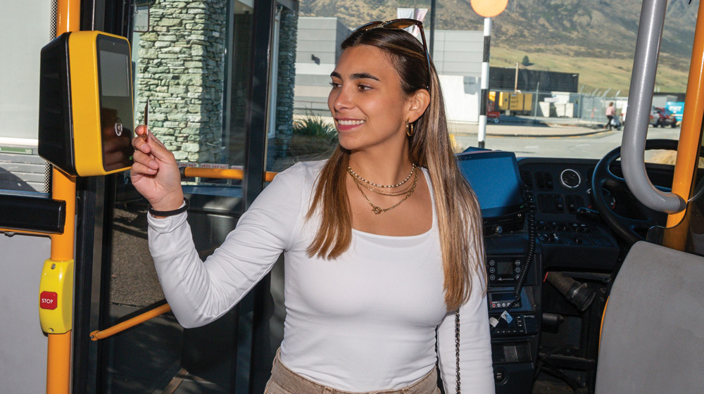 Adult using bee card to tag off bus in Queenstown Fares 1920X1080 Web Tile