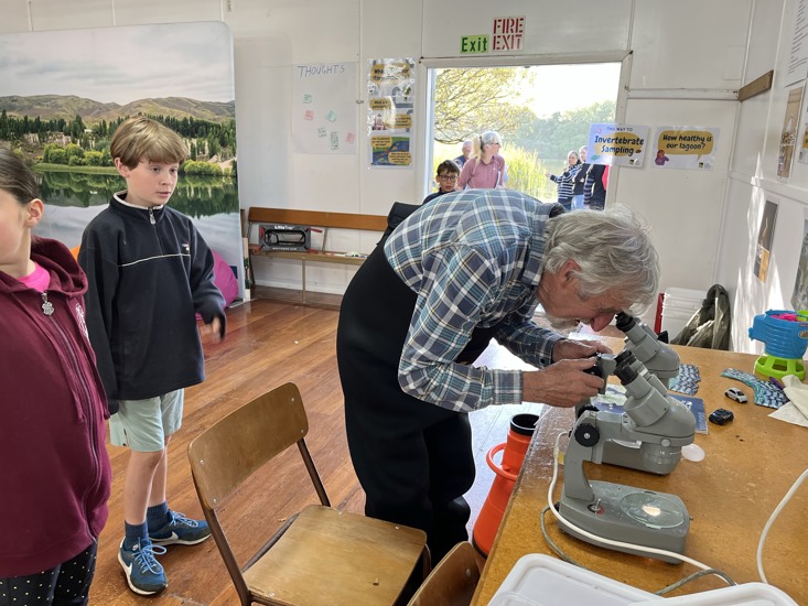 Ecotago Scientist Andrew Innes Sets Up A Microscope To Show Youngsters The Tiny Creatures Living In The Water Of Tomahawk Lagoon.