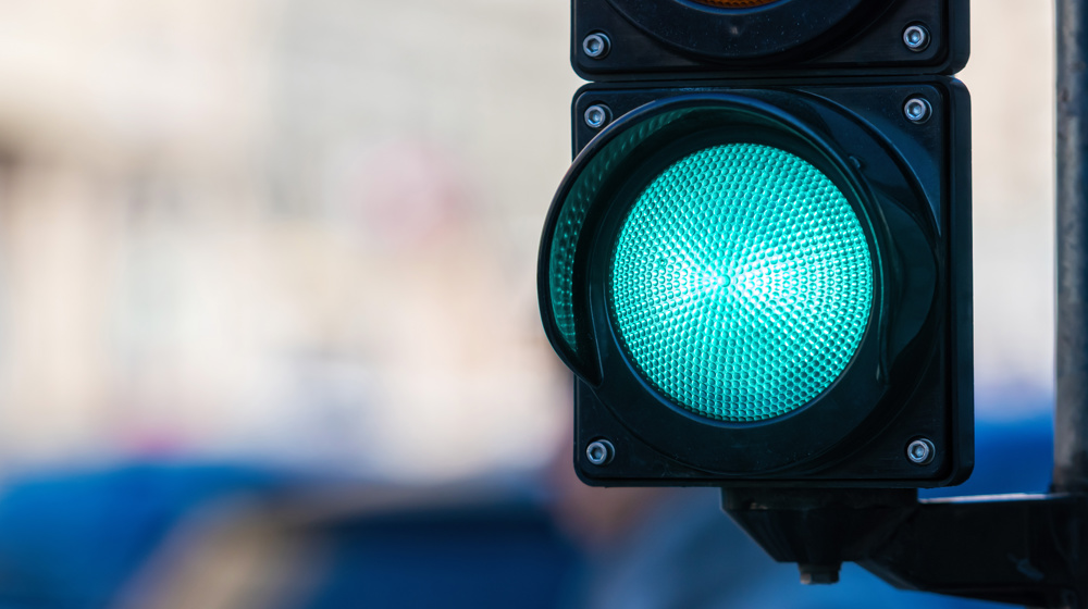 Close Up Of Traffic Semaphore With Green Light On Defocused City Street Background Adobestock 436253388